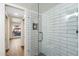 Glass enclosed shower with white subway tile in bright updated bathroom at 1351 N Pleasant Dr # 1012, Chandler, AZ 85225
