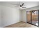 Cozy bedroom featuring contemporary flooring and a sliding glass door providing natural light at 1351 N Pleasant Dr # 1012, Chandler, AZ 85225