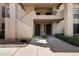 Exterior of the condo building with a walkway leading to the front door at 1351 N Pleasant Dr # 1012, Chandler, AZ 85225