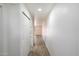 Bright hallway features wood-look floors and a closet for convenient storage at 1351 N Pleasant Dr # 1012, Chandler, AZ 85225