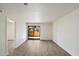Spacious living room featuring a sliding glass door providing access to an outdoor patio at 1351 N Pleasant Dr # 1012, Chandler, AZ 85225