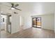 Inviting living room with a ceiling fan, and access to laundry, bathroom and outdoor patio at 1351 N Pleasant Dr # 1012, Chandler, AZ 85225