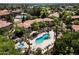 Aerial view of pool with mature trees and ample lounge seating at 1351 N Pleasant Dr # 1012, Chandler, AZ 85225