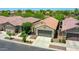 Neighborhood aerial view showcasing well-maintained homes with desert landscaping and tile roofs on a sunny day at 14160 W Georgia Dr, Surprise, AZ 85379