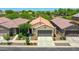 Neighborhood aerial view showcasing well-maintained homes with desert landscaping and tile roofs on a sunny day at 14160 W Georgia Dr, Surprise, AZ 85379