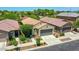 Neighborhood aerial view showcasing well-maintained homes with desert landscaping and tile roofs on a sunny day at 14160 W Georgia Dr, Surprise, AZ 85379