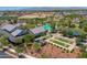 Beautiful aerial showing community pool, clubhouse, and outdoor game area in well-maintained community at 14160 W Georgia Dr, Surprise, AZ 85379