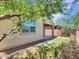 The home has a beautiful backyard with artificial grass and desert landscaping at 14160 W Georgia Dr, Surprise, AZ 85379