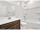 Well-lit bathroom with a modern vanity and a bathtub-shower combo, perfect for relaxation at 14160 W Georgia Dr, Surprise, AZ 85379