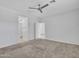 A bedroom featuring plush carpeting and a modern ceiling fan for added comfort at 14160 W Georgia Dr, Surprise, AZ 85379