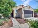 Charming single-Gathering home with desert landscaping in the front yard at 14160 W Georgia Dr, Surprise, AZ 85379