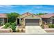 Charming single-Gathering home featuring a neutral-toned facade, low maintenance landscape, and an attached two-car garage at 14160 W Georgia Dr, Surprise, AZ 85379