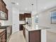 Gourmet kitchen featuring stainless steel appliances and a spacious island with granite countertops at 14160 W Georgia Dr, Surprise, AZ 85379