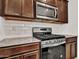 Gas range cooktop with stainless steel appliances and beautiful cabinetry at 14160 W Georgia Dr, Surprise, AZ 85379