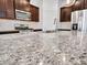 Kitchen island with granite countertops and stainless steel sink and faucet at 14160 W Georgia Dr, Surprise, AZ 85379