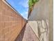 The home has a side yard with desert landscaping and a privacy wall at 14160 W Georgia Dr, Surprise, AZ 85379