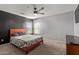 Bedroom features a ceiling fan and two windows at 14895 W Jenan Dr, Surprise, AZ 85379