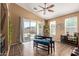 Cozy dining area with a stylish table, sliding glass doors, and neutral decor at 14895 W Jenan Dr, Surprise, AZ 85379