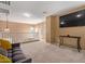 Bright loft area with couch, desk and TV at 14895 W Jenan Dr, Surprise, AZ 85379