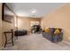 Open loft with a large window, sofa, bean bag chair and desk at 14895 W Jenan Dr, Surprise, AZ 85379