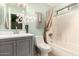 Updated bathroom with modern vanity, fixtures, and shower-tub combination at 14919 W Hearn Cir, Surprise, AZ 85379