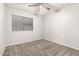 Cozy bedroom features neutral paint and plush carpeting at 14919 W Hearn Cir, Surprise, AZ 85379