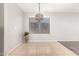 Bright dining space with a modern chandelier, offering a view of the outdoors at 14919 W Hearn Cir, Surprise, AZ 85379