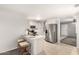 Modern kitchen with stainless steel appliances, a breakfast bar, and tile flooring at 14919 W Hearn Cir, Surprise, AZ 85379