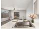 Bright kitchen featuring stainless steel sink, granite countertops, and dining area with outdoor access at 14919 W Hearn Cir, Surprise, AZ 85379