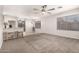 Bright living room with a cozy bar-style dining into the kitchen at 14919 W Hearn Cir, Surprise, AZ 85379