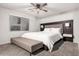 Serene main bedroom with a large window, soft carpet, and contemporary furnishings at 14919 W Hearn Cir, Surprise, AZ 85379
