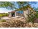 Landscaped backyard area with patio and plants at 16373 W Beautiful Ln, Goodyear, AZ 85338