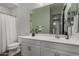 Bathroom featuring a shower with curtain and a white vanity with a large mirror at 16373 W Beautiful Ln, Goodyear, AZ 85338