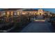 Outdoor area with a walkway, decorative planters, and outdoor seating provides an inviting space at 16373 W Beautiful Ln, Goodyear, AZ 85338