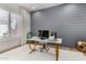 Modern office featuring a desk, comfortable chair, and stylish decor at 16373 W Beautiful Ln, Goodyear, AZ 85338