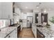 Spacious kitchen showcasing a stainless refrigerator, and granite countertops, with ample counter space at 16373 W Beautiful Ln, Goodyear, AZ 85338