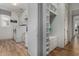 Laundry room featuring modern appliances and storage at 16373 W Beautiful Ln, Goodyear, AZ 85338