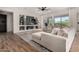 Inviting living room featuring light hardwood floors, recessed lights, and sliding glass doors with natural light at 16373 W Beautiful Ln, Goodyear, AZ 85338