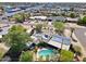 Aerial view of the property showing the layout, pool, solar panels, and surrounding neighborhood at 1749 W Monterosa St, Phoenix, AZ 85015