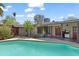 A backyard features a beautiful pool with a clear blue sky above at 1749 W Monterosa St, Phoenix, AZ 85015