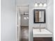 Bathroom featuring mosaic tiles, modern lighting, and an open doorway at 1749 W Monterosa St, Phoenix, AZ 85015