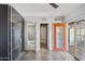 A bedroom boasts a variety of door options and a shiny black closet system at 1749 W Monterosa St, Phoenix, AZ 85015