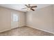 Empty room with tile floors and a door to the outside at 1749 W Monterosa St, Phoenix, AZ 85015