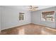 Empty bedroom with two windows and tile floors at 1749 W Monterosa St, Phoenix, AZ 85015