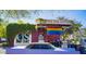 Unique roadside coffee shop with retro design, colorful details, and classic cars at 1749 W Monterosa St, Phoenix, AZ 85015