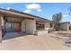 The exterior features desert landscaping, a carport, and a vibrant red door at 1749 W Monterosa St, Phoenix, AZ 85015