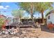Landscaped garden area with raised beds, rocks, and a variety of plants at 1749 W Monterosa St, Phoenix, AZ 85015
