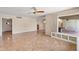 A wide open living room with a bay window, access to the kitchen and exterior porch at 1749 W Monterosa St, Phoenix, AZ 85015