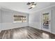 A living room with new floors, fresh paint, new light fixtures, and a modern sliding door at 1749 W Monterosa St, Phoenix, AZ 85015