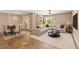 Bright living room boasts neutral tones, a large sofa, and a modern ceiling fan at 1749 W Monterosa St, Phoenix, AZ 85015